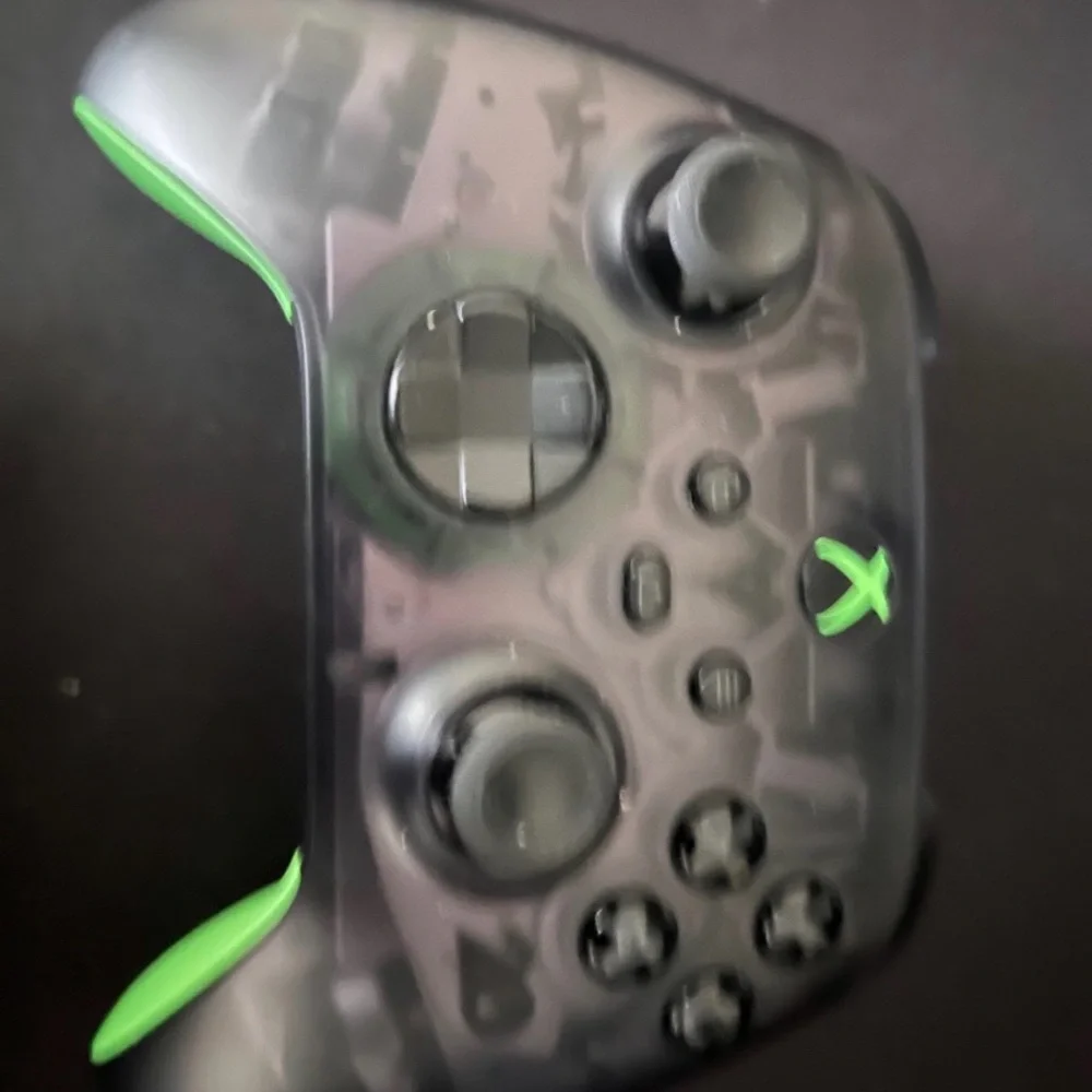 Microsoft Xbox Console with Black and Green Controllers